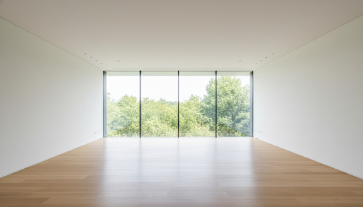 Empty room with floor-to-ceiling windows, before staging